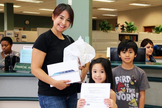 At the Lemoore West Hills College campus, Teresa Beleczar was the first in line to pick up her new Ipad.